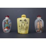 Three Chinese snuff bottles to include a buffalo bone hand-carved erotic example with 2 Peking glass