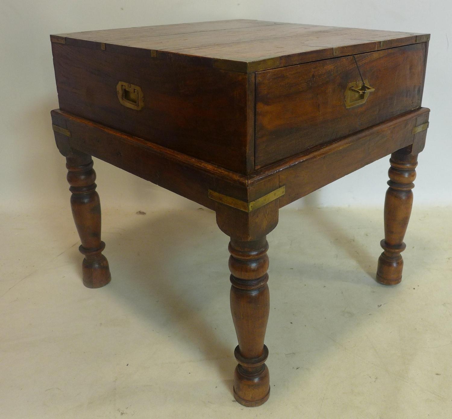 A 20th century campaign style brass bound teak chest on stand, H.60 W.60 D.60cm