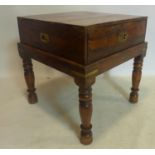 A 20th century campaign style brass bound teak chest on stand, H.60 W.60 D.60cm
