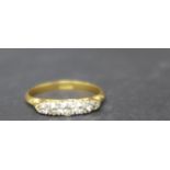 An 18ct yellow gold and five stone diamond ring, marked 18ct