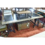 An Industrial style table, raised on metal supports, W.200 D.91cm