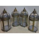 A set of four gilt metal and glass storm lanterns, H.48cm