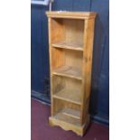 An antique rustic pine petite bookcase of 4 compartments