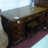 A Georgian style mahogany pedestal desk, H.75 W.135 D.70cm