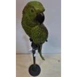 A green fibreglass model of a parrot on stand, H.120cm