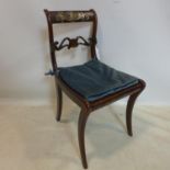 A Regency mahogany chair with cane seat and brass inlay, needs some restoration