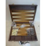 A Crisloid Tournament Attaché backgammon set, with checkers, dice and dice cups, in an attaché case,