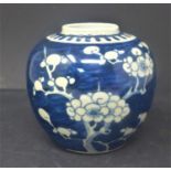 A 19th century Chinese blue and white ginger jar, decorated with prunus, bearing double blue