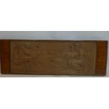 An Art Deco mahogany panel carved with man playing harp to two lovers, H.45 W.135 D.6cm