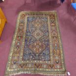 An antique Qashqai carpet with 3 geometric medallions, surrounded by geometric floral motifs on a
