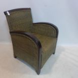 A teak and wicker armchair