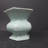 A Chinese celadon glazed vase, of hexagonal form with everted rim, on spreading base, bearing seal