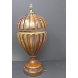 A Regency style mahogany urn and cover with brass finial, H.36cm