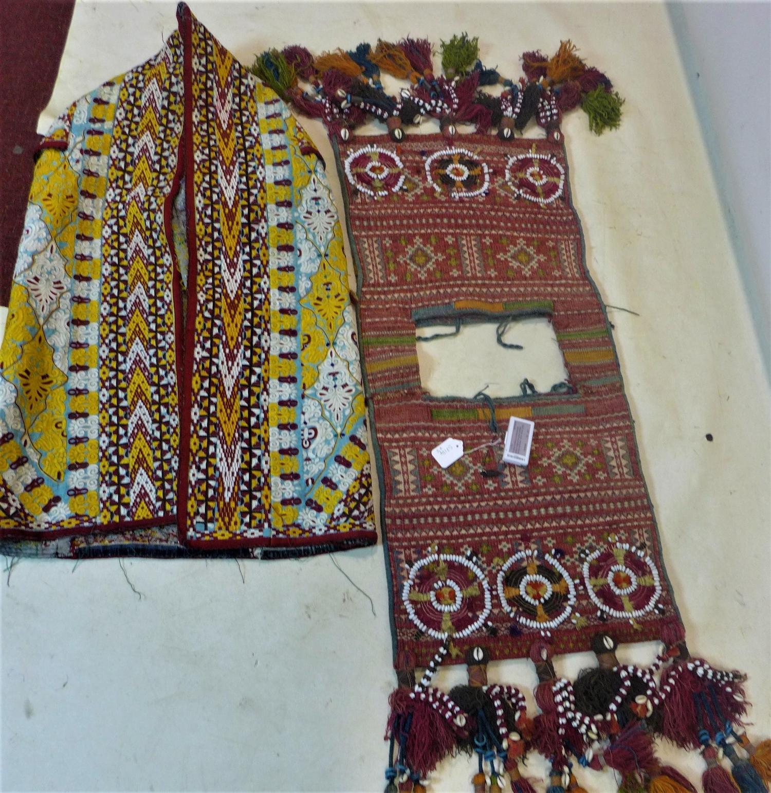 A Turkoman Yomud ceremonial saddle bag, together with a Turkoman silk embroidered kaftan