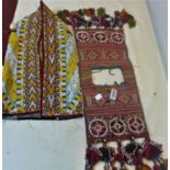 A Turkoman Yomud ceremonial saddle bag, together with a Turkoman silk embroidered kaftan