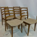 A set of four 20th century teak dining chairs