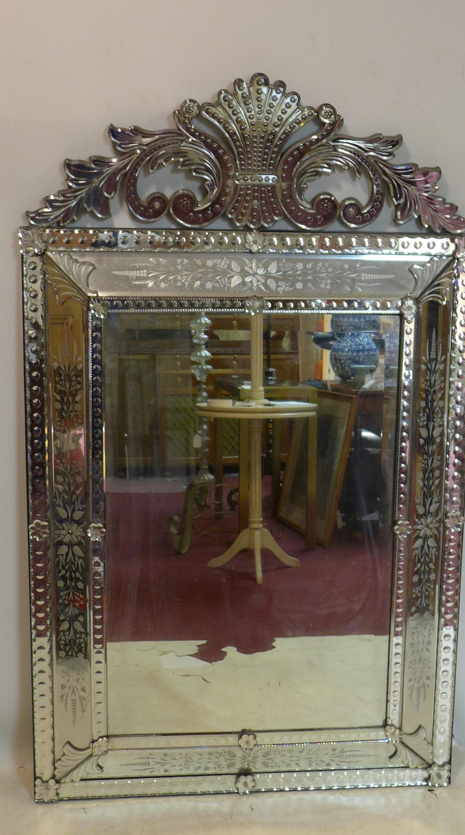 A large 20th century Venetian mirror with acid etched decoration and bevelled plates, 152 x 92cm