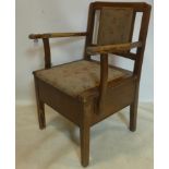 A 20th century commode, with floral upholstered seat and backrest, raised on square legs, H.82 W.