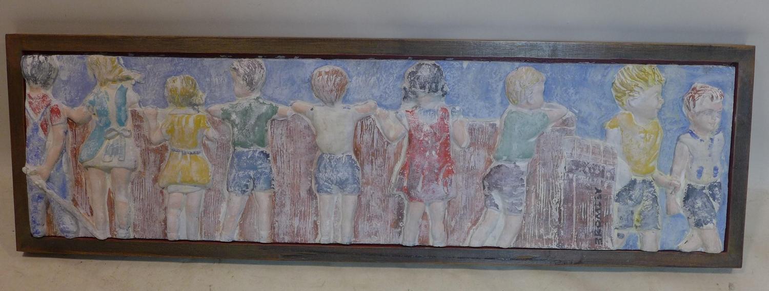 A contemporary plaster frieze moulded with children looking over a wall, signed Bromley, 34 x 124cm,
