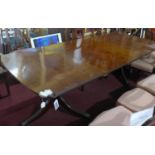 A late 19th century mahogany dining table with 2 extra leaves, raised on twin pedestal supports, 3