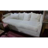 A large contemporary 4 seat sofa, in a cream upholstery