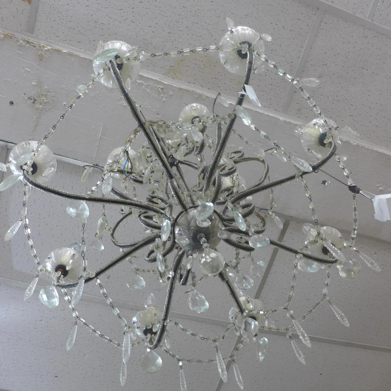 A Venetian style 8 branch chandelier with glass droplets