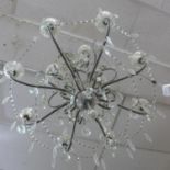 A Venetian style 8 branch chandelier with glass droplets