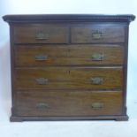 A 19th century mahogany chest of drawers with pierced brass handles having 2 short drawers over 3