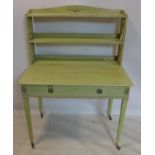 A 20th century painted desk with superstructure over single drawer, raised on tapered legs and