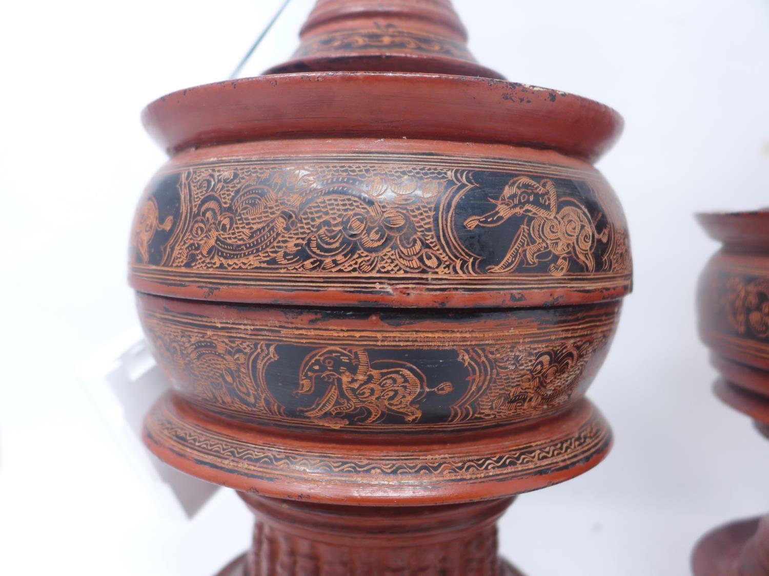 Two late 19th century Burmese red lacquer offering vessels 'Hsunok', decorated with elephants and - Image 2 of 4