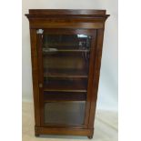 A Victorian mahogany display cabinet, with single drawer above glazed door, enclosing adjustable
