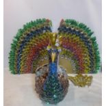Edgardo Rodriguez (Contemporary artist), a large sculpture of a peacock made from plastic bottles,