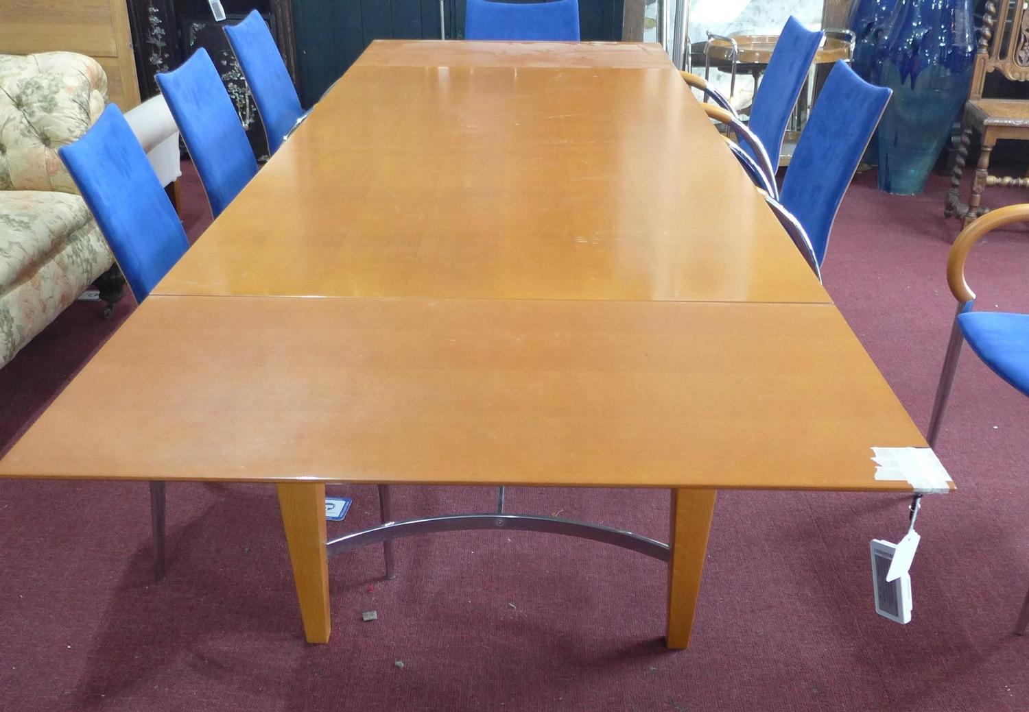 A contemporary extending dining table reportedly from Harrods, H.74 W.276 D.90cm