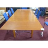 A contemporary extending dining table reportedly from Harrods, H.74 W.276 D.90cm