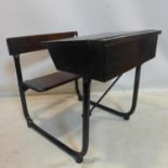A vintage school desk with lift up seat