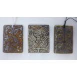 Three early 20th century Chinese carved hardstone pendants