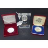 Three silver coins to include 2 commemorative coins and a 1oz Chinese silver coin