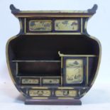 A 19th century Japanese red lacquered table top cabinet, with gilt painted drawers and doors,