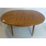 A 20th century G-plan teak extending dining table, with butterfly leaf, raised on tapered legs, H.74
