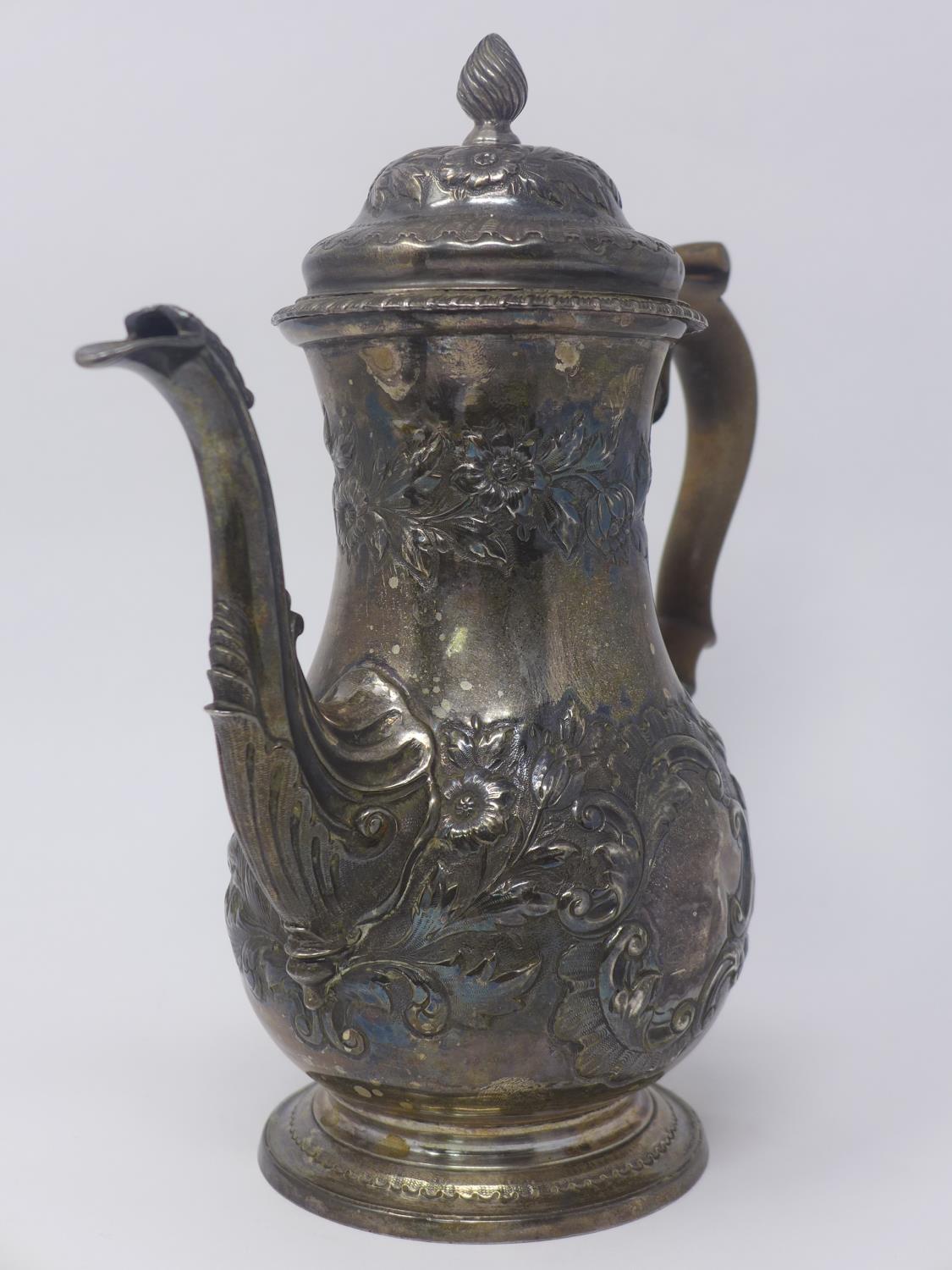 WITHDRAWN - A George III silver tea pot with embossed floral decoration, dated 1762, H.25cm, 25oz - Image 4 of 4
