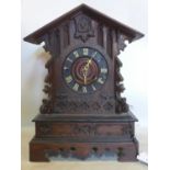 An antique oak cucko clock with brass movement, H.46 W.32 D.18cm