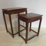 A 20th century Chinese hardwood nest of 2 tables