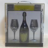 A Dom Perignon flight case with a bottle of 1973 Dom Perignon and 2 flutes, unopened