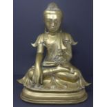 A large early 20th century Tibetan bronze study of a seated Buddha, H.38 W.28 D.18cm
