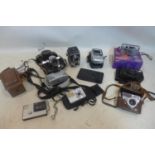 A collection of vintage cameras to include Halina, Palmat and Praktica