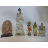 Three early 20th century painted plaster religious figures of Indian gods together with a carved