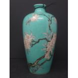 A Chinese porcelain ovoid vase, with floral decoration on a turquoise ground, bearing blue & white