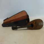 An antique Italian mandolin with label for 'Stridente', with travel case