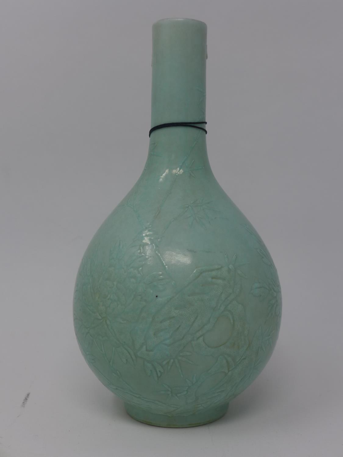 An early 20th century Chinese celadon glazed vase, floral decoration, bearing character marks to