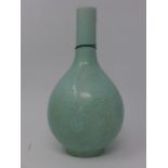 An early 20th century Chinese celadon glazed vase, floral decoration, bearing character marks to
